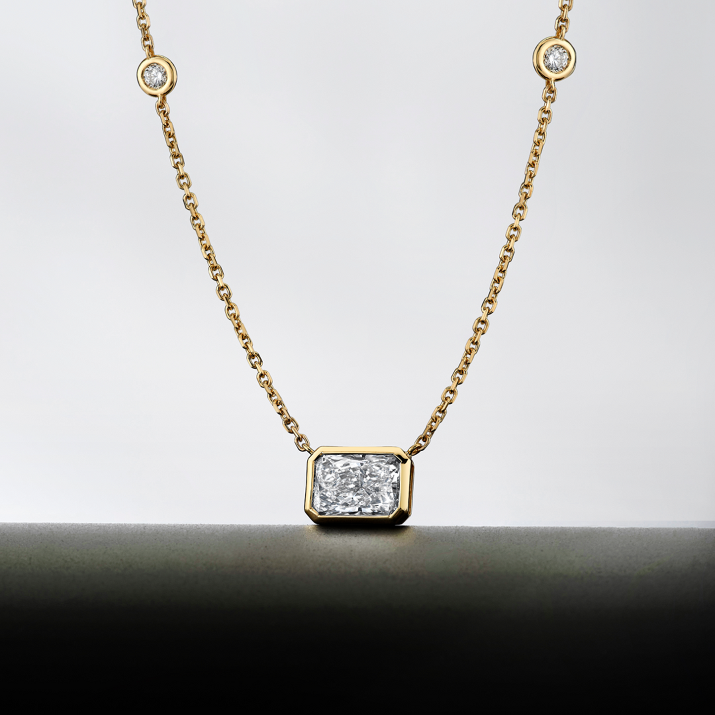 Diamond Station Pendant with Radiant Cut Center Stone