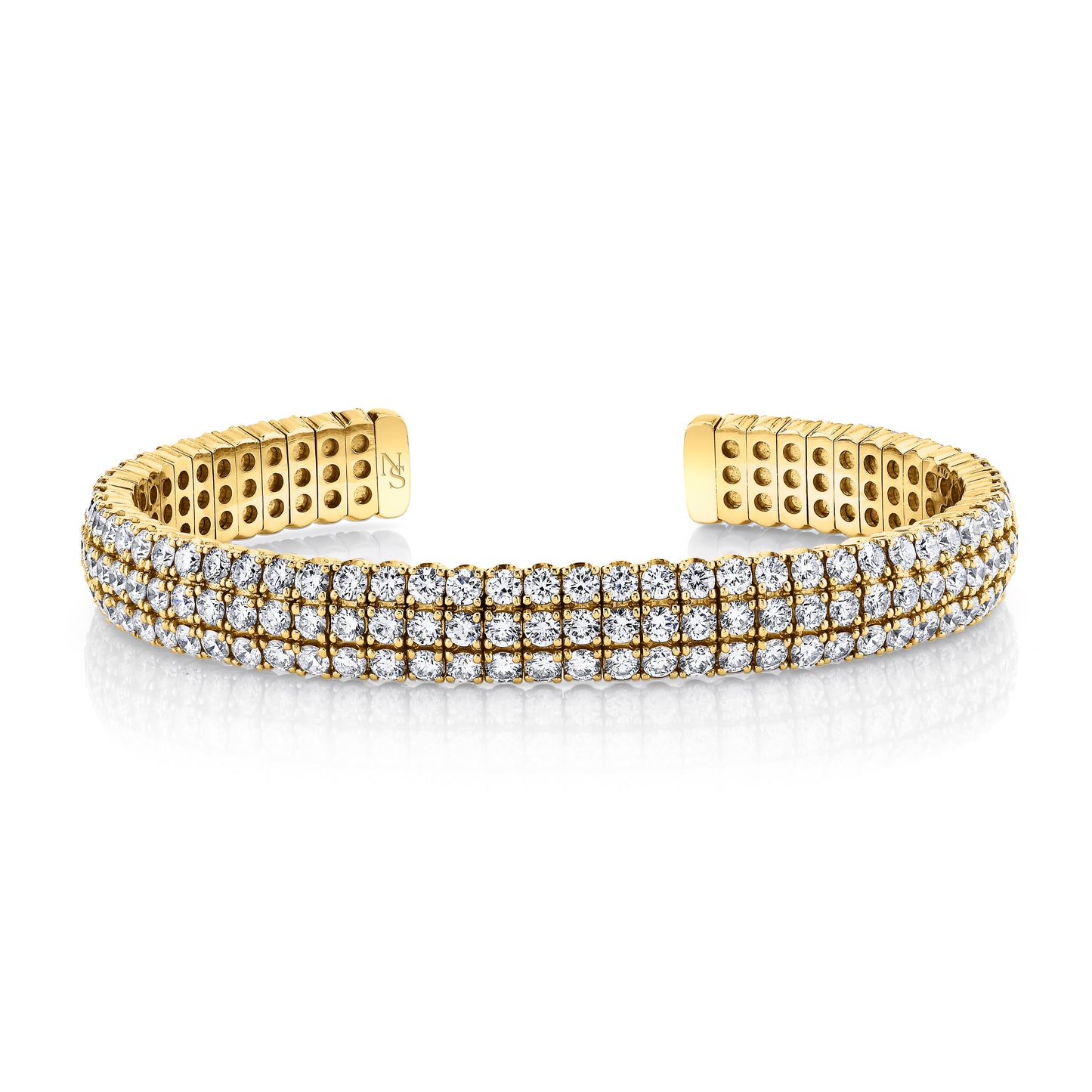 Gold bangle bracelet with diamonds.