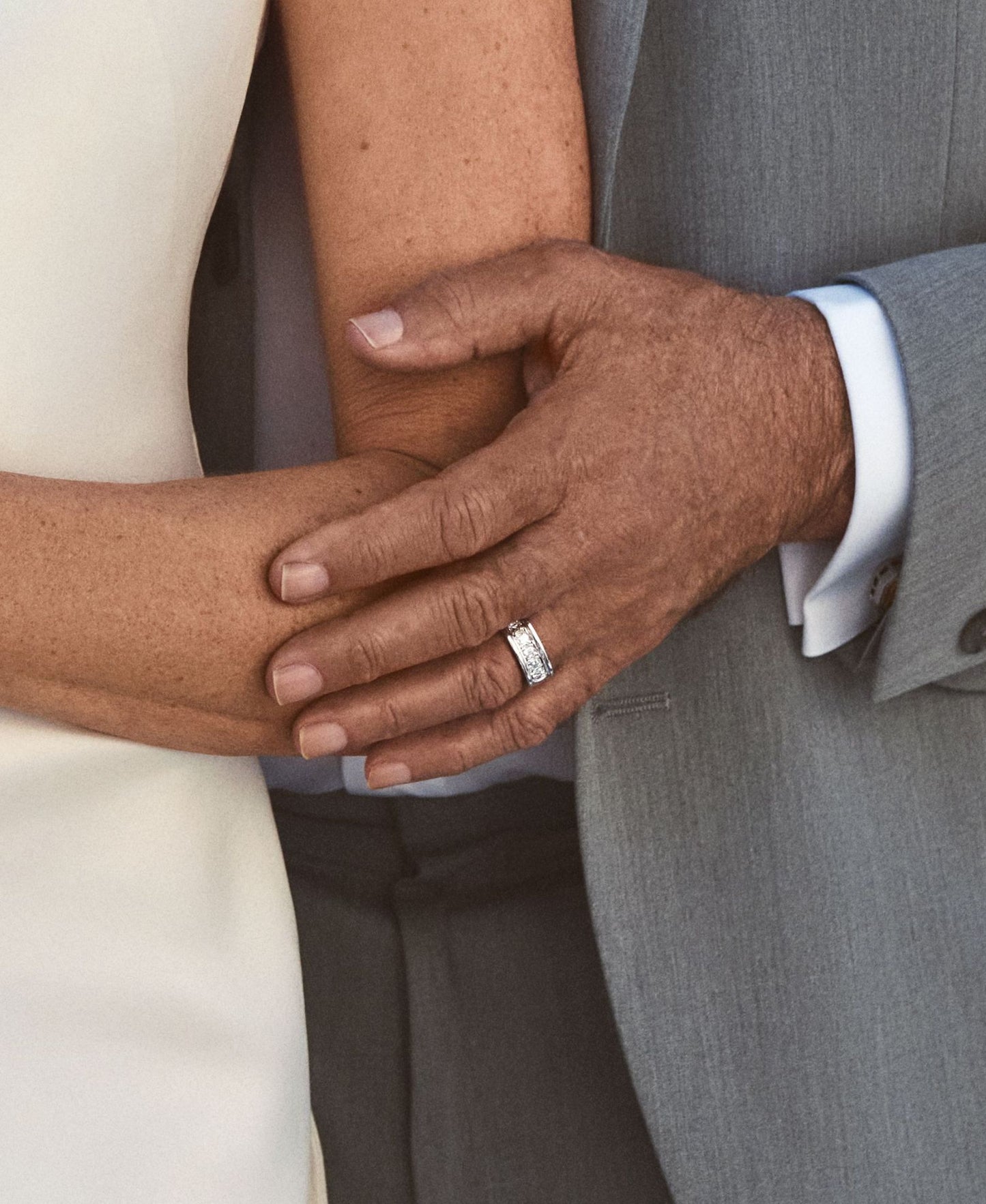 Close-up of a men's wedding band, made with natural diamonds and set in 18k white gold.
