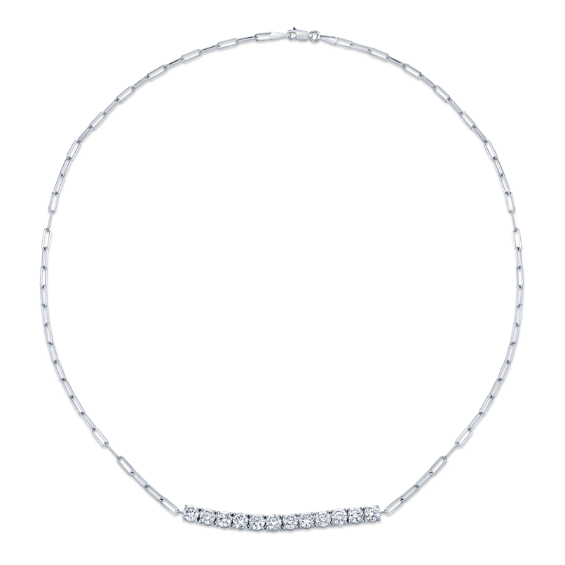 A floating Norman Silverman round brilliant diamond pendant on an 18k white gold paperclip chain.