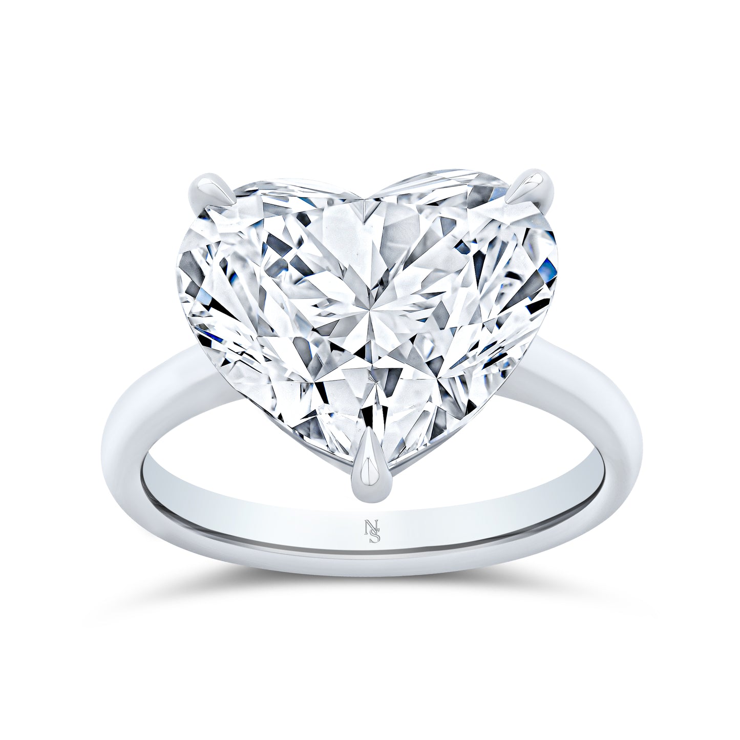 Heart-shaped diamond ring set in white gold.