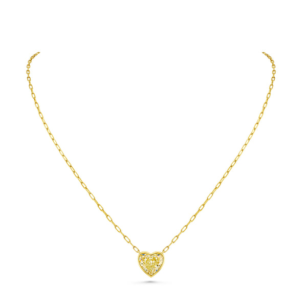 A heart-shaped yellow diamond pendant suspended from a gold chain by Norman Silverman