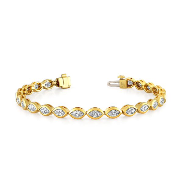 Norman Silverman bezel set marquise shaped diamond bracelet in 18k yellow gold.