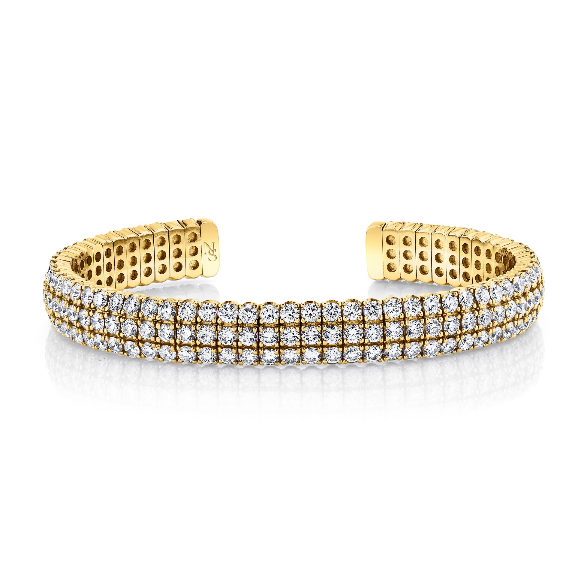 Gold bangle bracelet with diamonds.