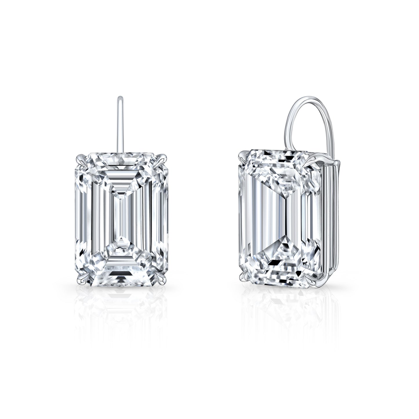 A pair of emerald cut diamond drop earrings set in white gold, showcasing a clear and sparkling stone.