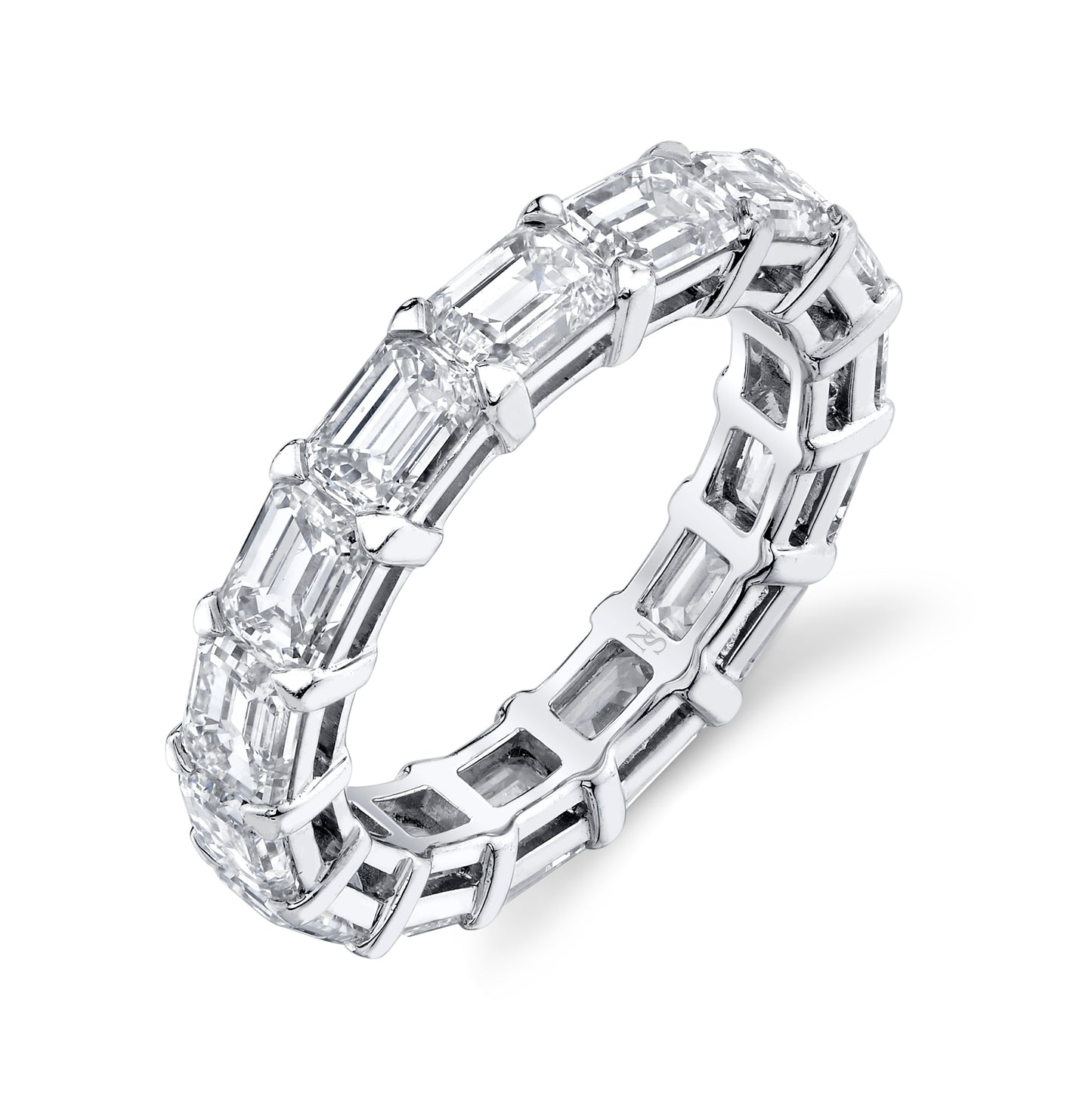 An exquisite platinum eternity band featuring emerald cut diamonds set in a row, creating a luxurious and elegant appearance.