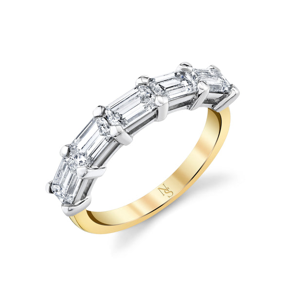A gold band ring with emerald-cut diamonds arranged in an east-west orientation.