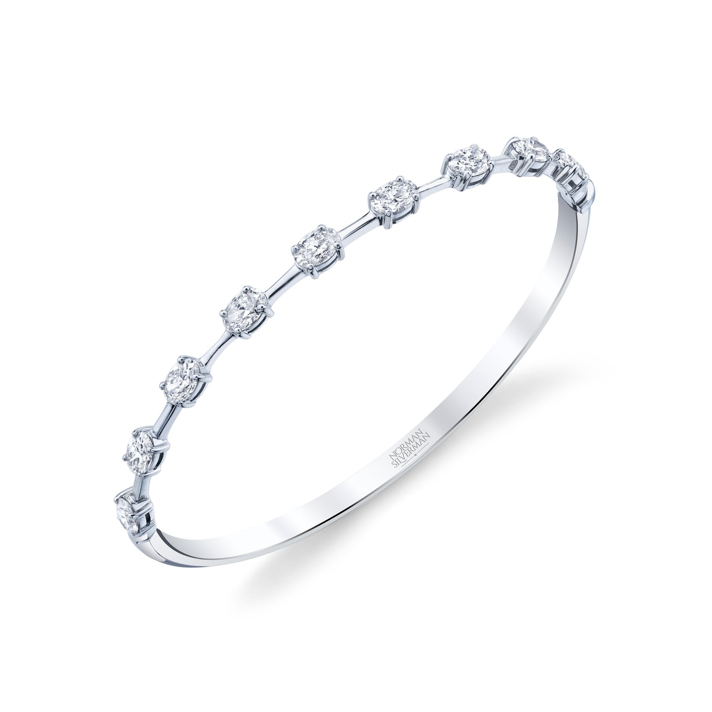 A silver bangle bracelet with multiple oval-cut diamonds set within a bar design.