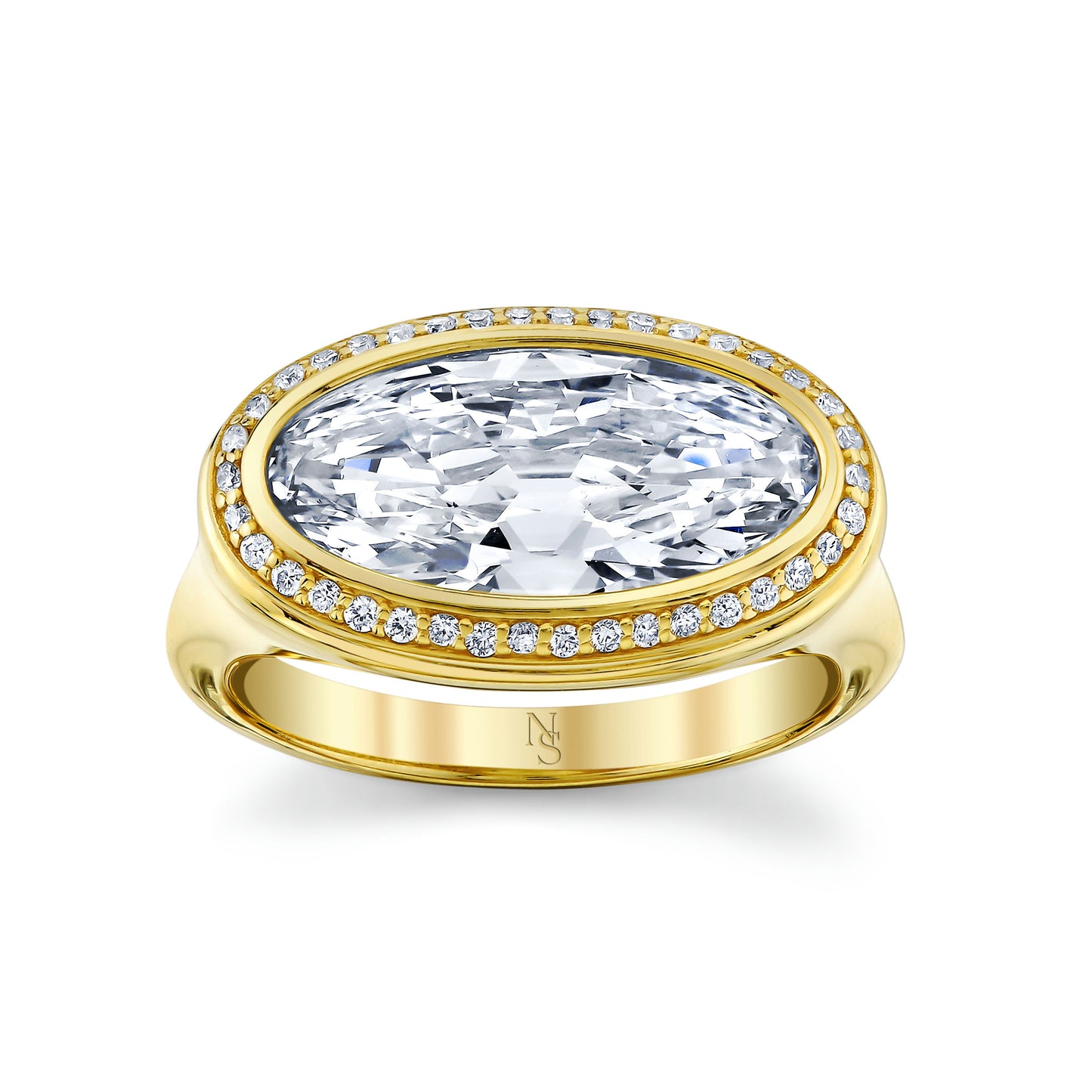 An oval cut diamond halo ring with a yellow gold band and smaller diamonds around the main stone.