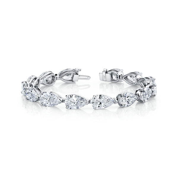 A platinum bracelet featuring pear-cut diamonds set in a straight-line design.