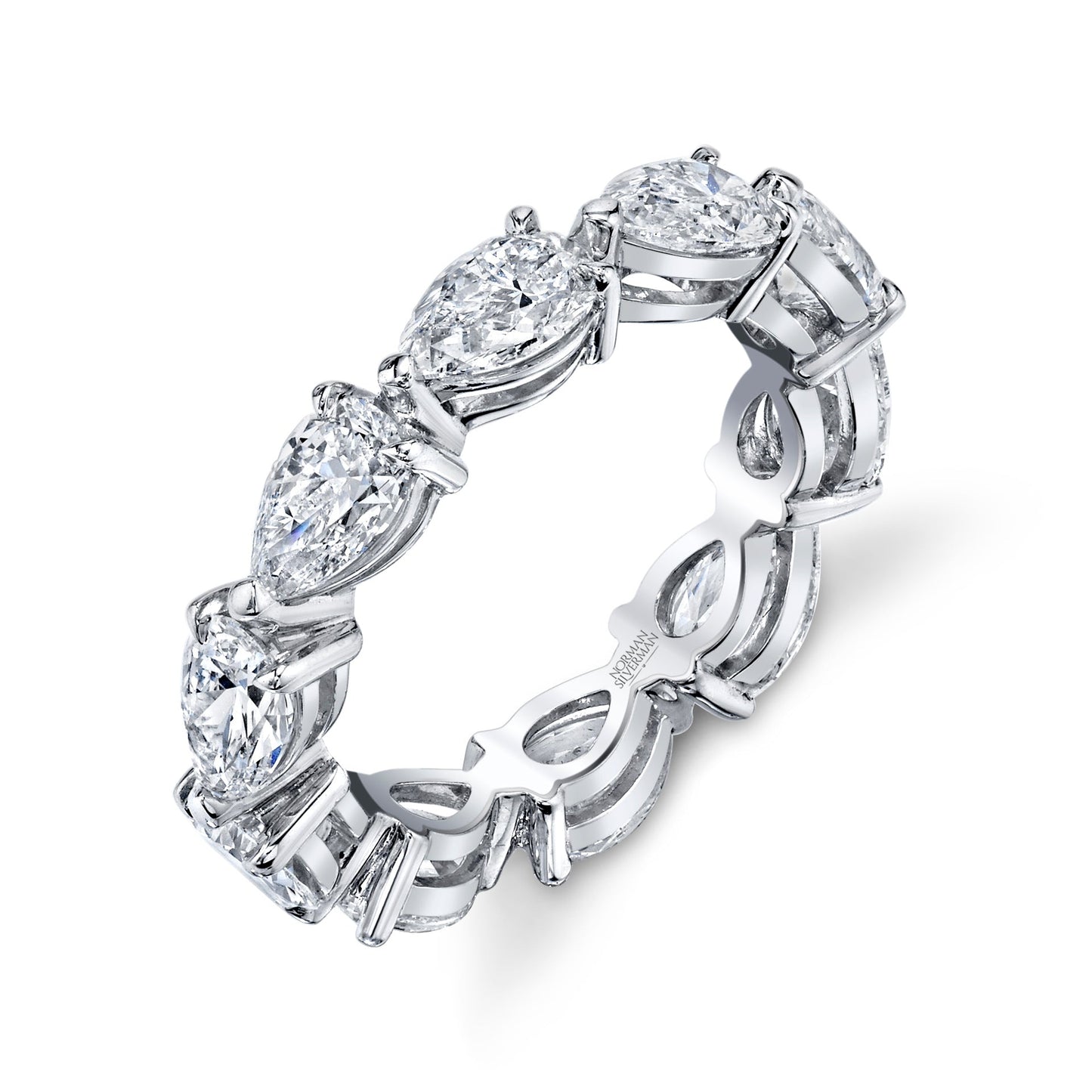 A platinum eternity band featuring pear-cut diamonds set in a west-east orientation.