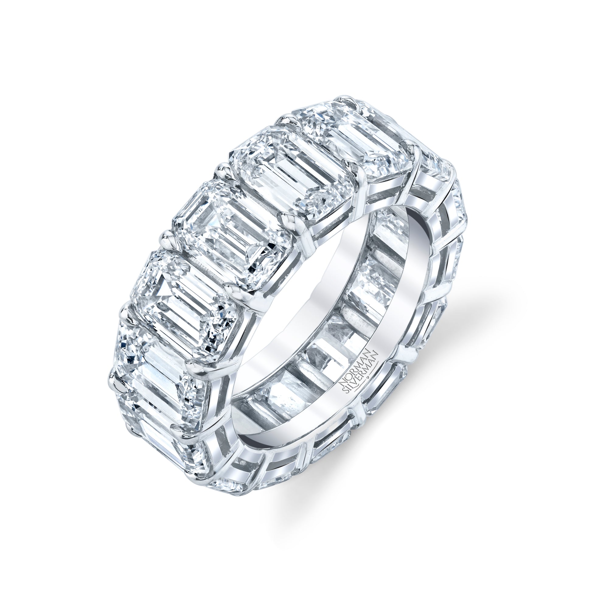 An emerald cut diamond eternity band with platinum setting
