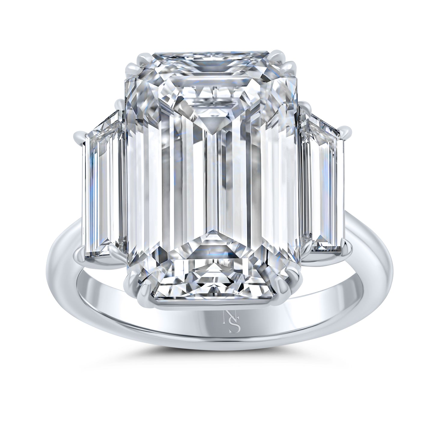 An emerald cut diamond ring with two side stones on a platinum band.