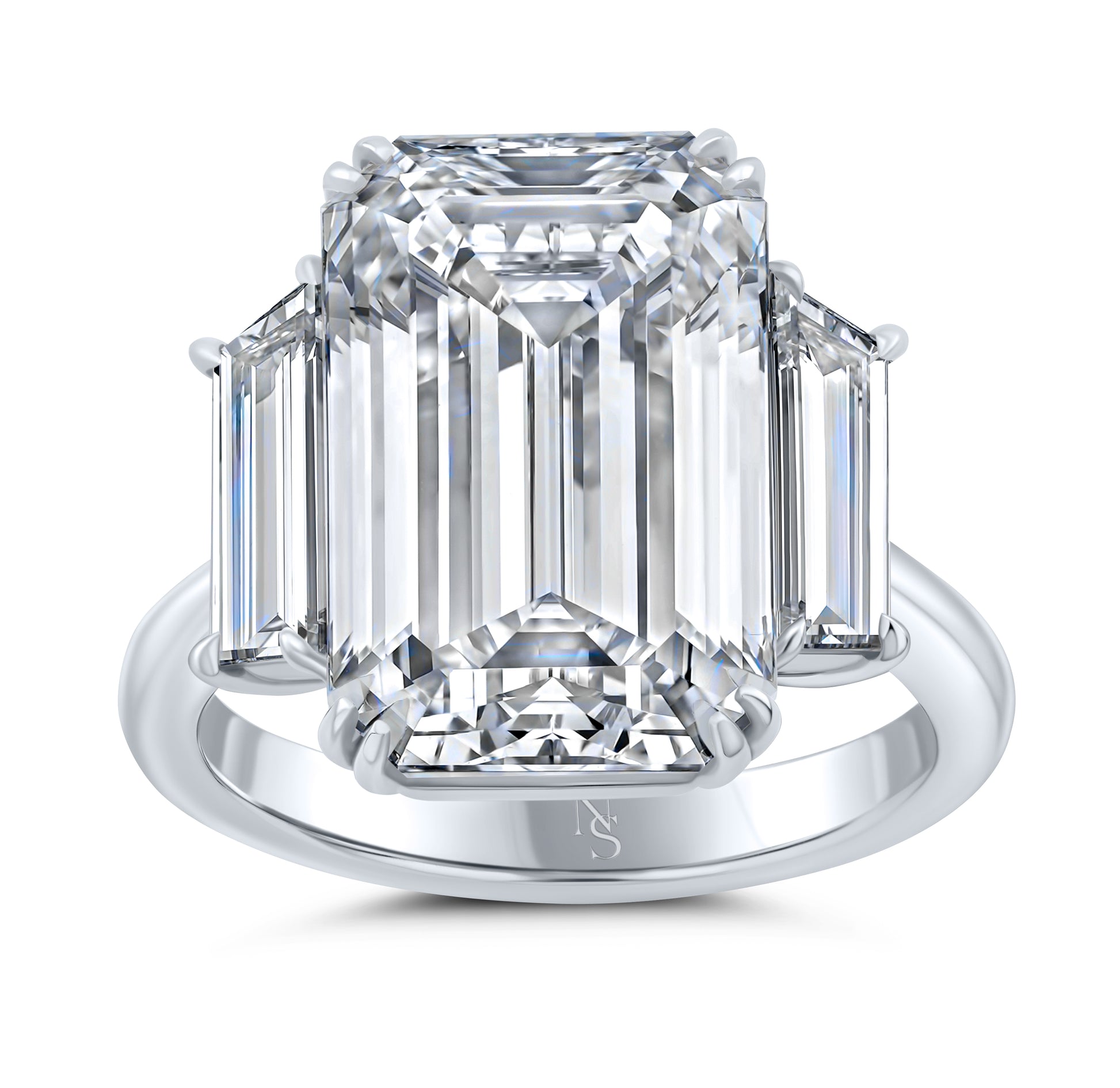 An emerald cut diamond ring with two side stones on a platinum band.