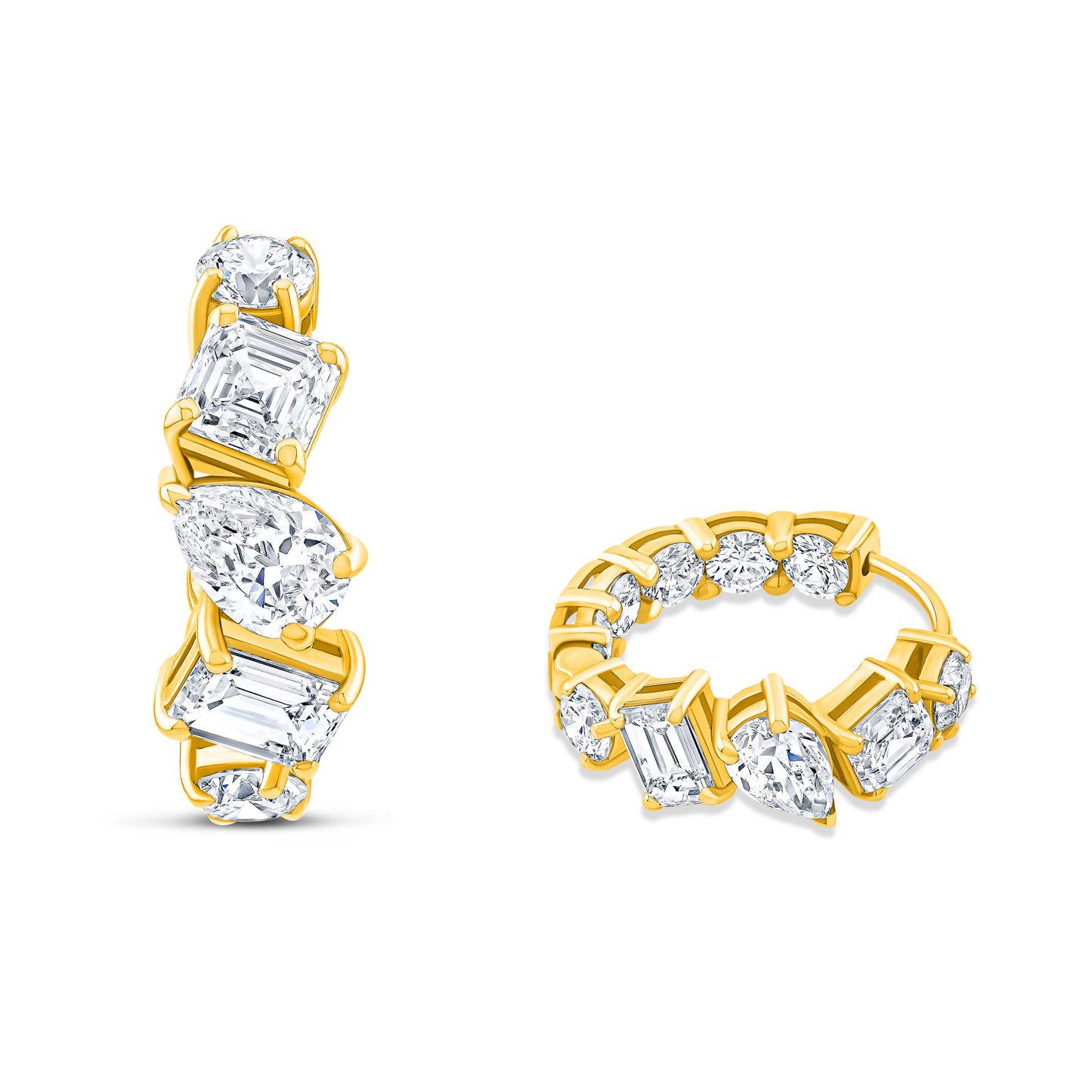 Gold and diamond huggie earrings on a white background