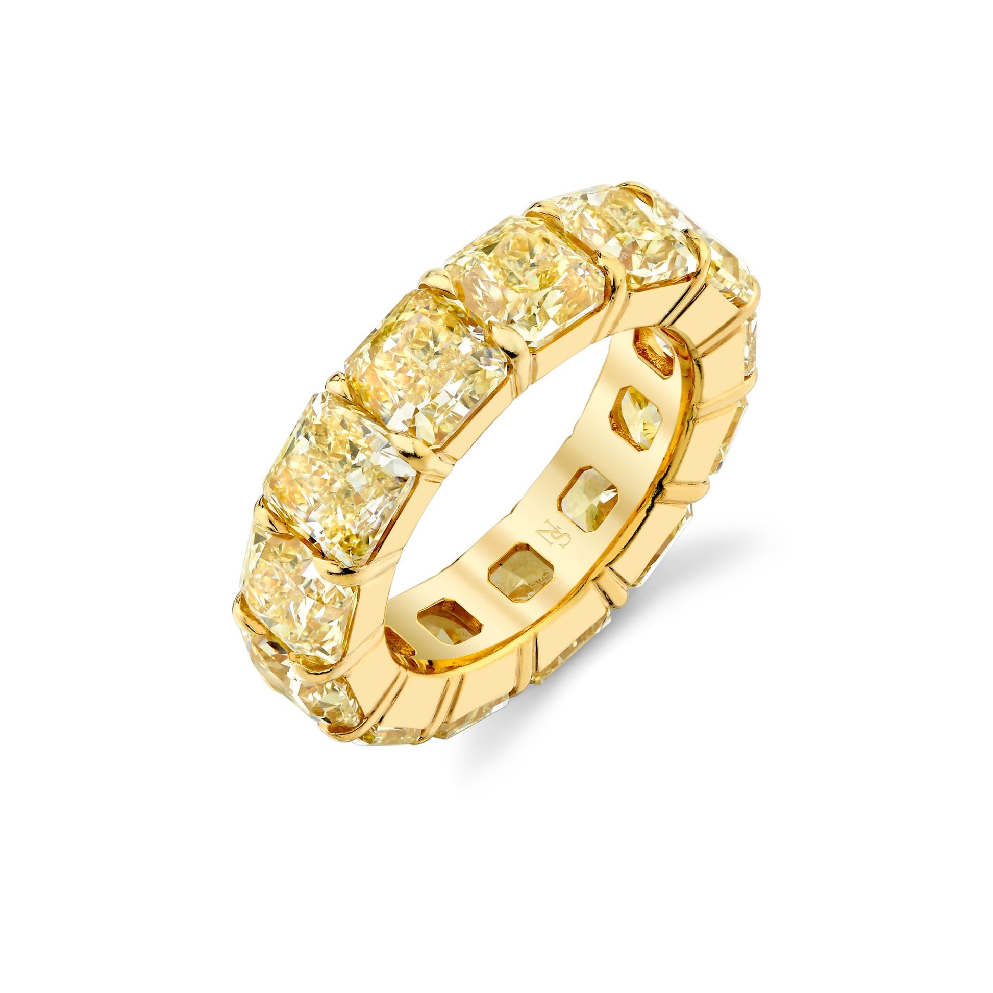 An 18K yellow gold eternity band featuring Fancy Yellow Radiant Cut diamonds