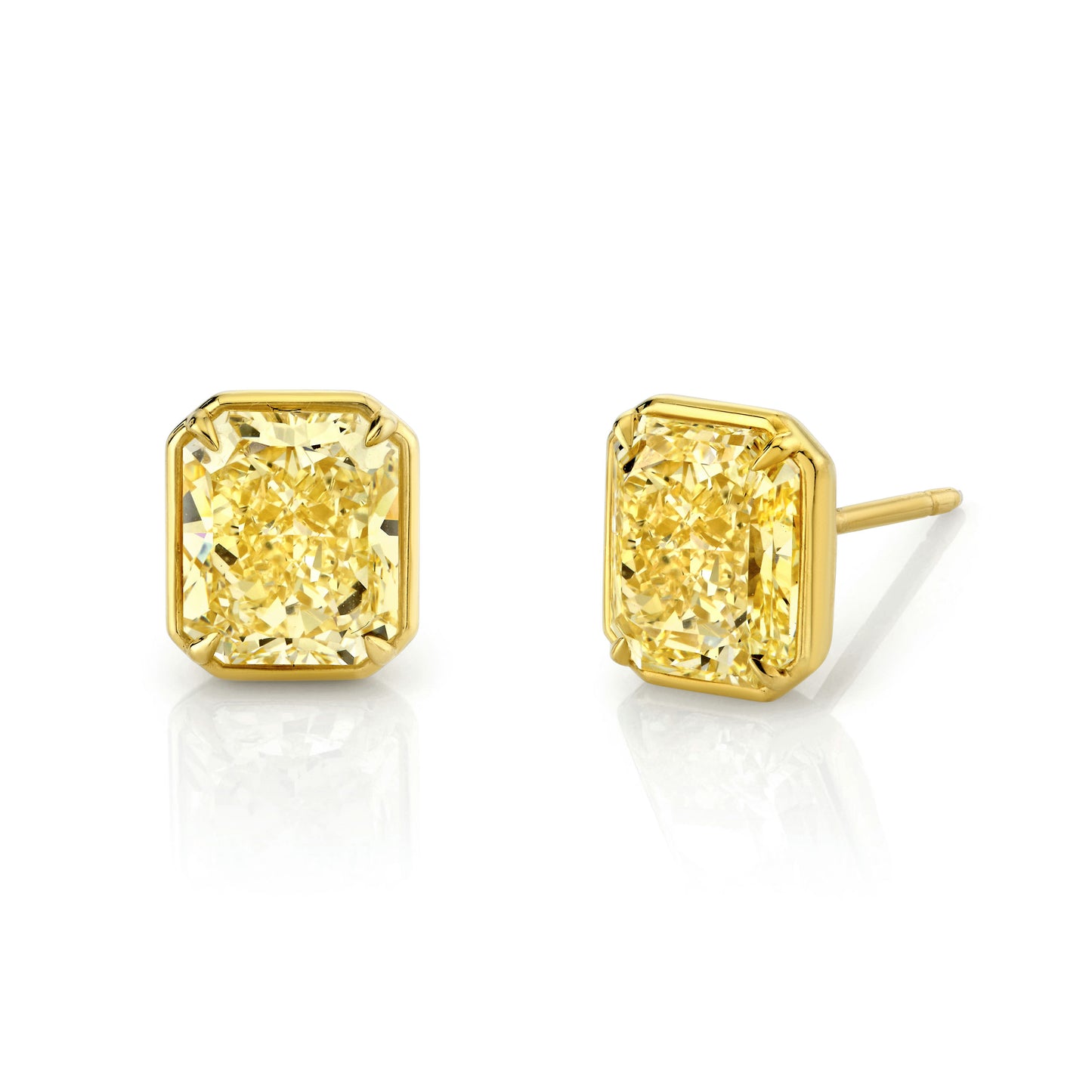 A pair of 18k yellow gold stud earrings featuring radiant-cut yellow diamonds.