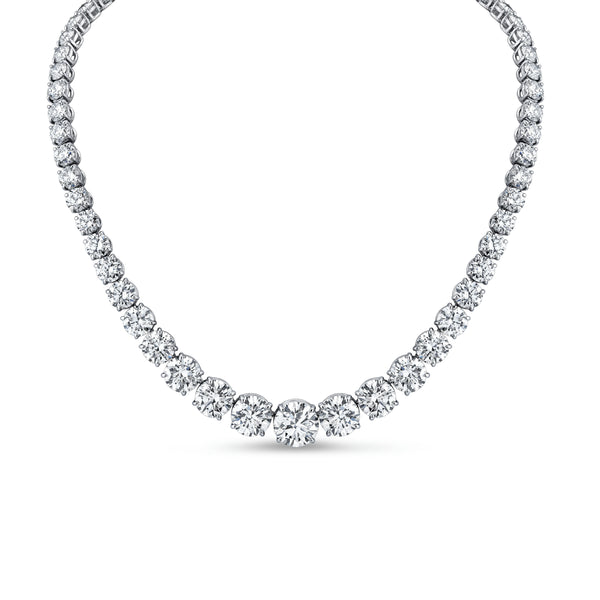 A graduated round diamond riviera necklace in platinum, featuring a series of round diamonds in a classic 4-prong setting.