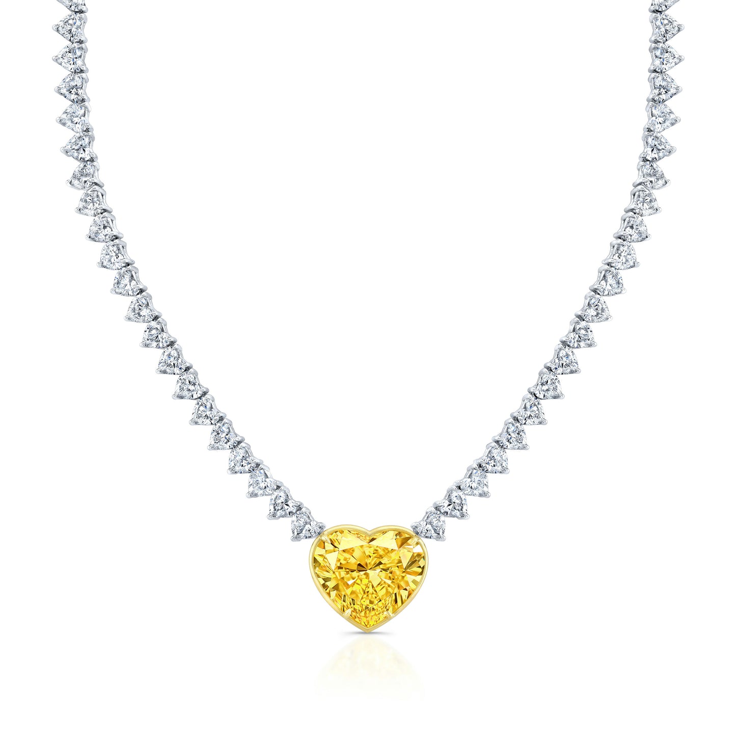 A heart-shaped diamond necklace with a fancy yellow center stone, surrounded by a line of smaller heart-shaped diamonds.