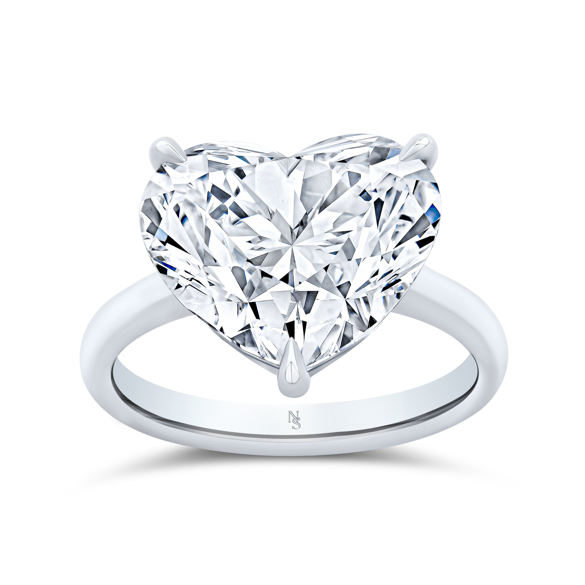 Heart-shaped diamond ring set in white gold.