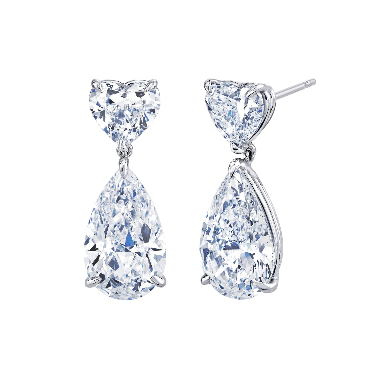 Pair of heart and teardrop-shaped diamond earrings on a white background