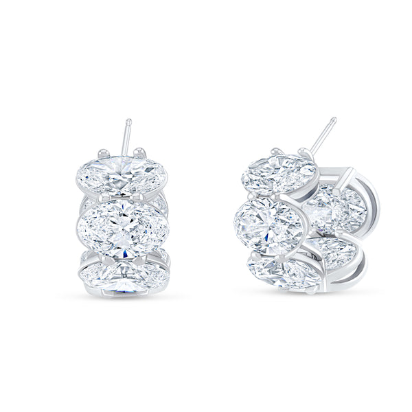 Large diamond 18k gold hoop earrings set in 18k white gold.