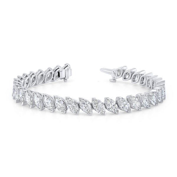 A white gold bracelet featuring marquise-cut diamonds set in a tilted pattern.