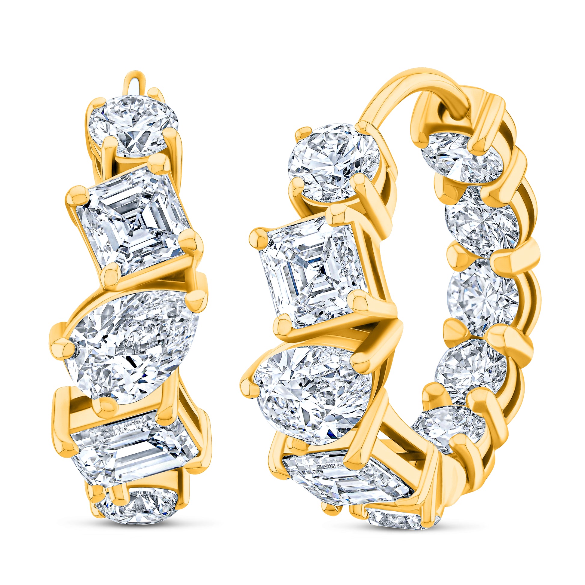 Diamond earrings with mixed shape diamonds in yellow gold.