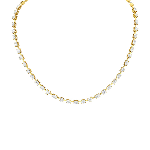A golddiamond necklace with a series of mixed chape diamonds set in a bar-style mounting.