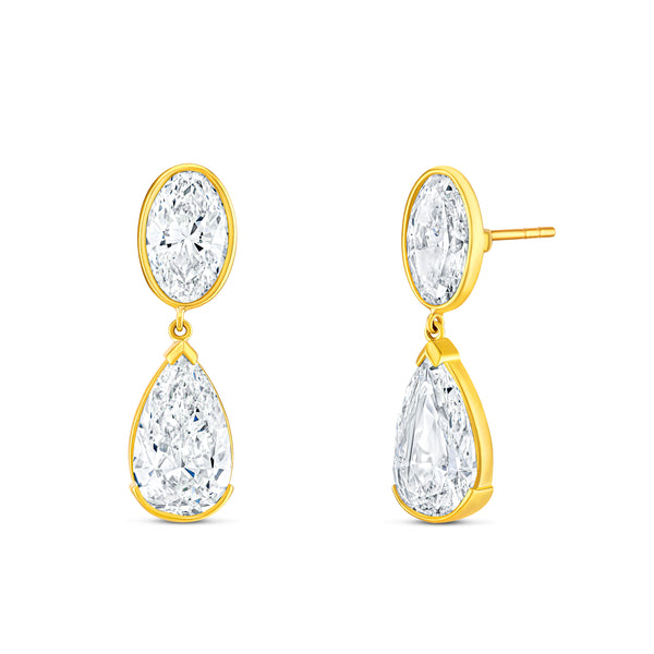 Gold earrings with white oval and pear-shaped diamonds.