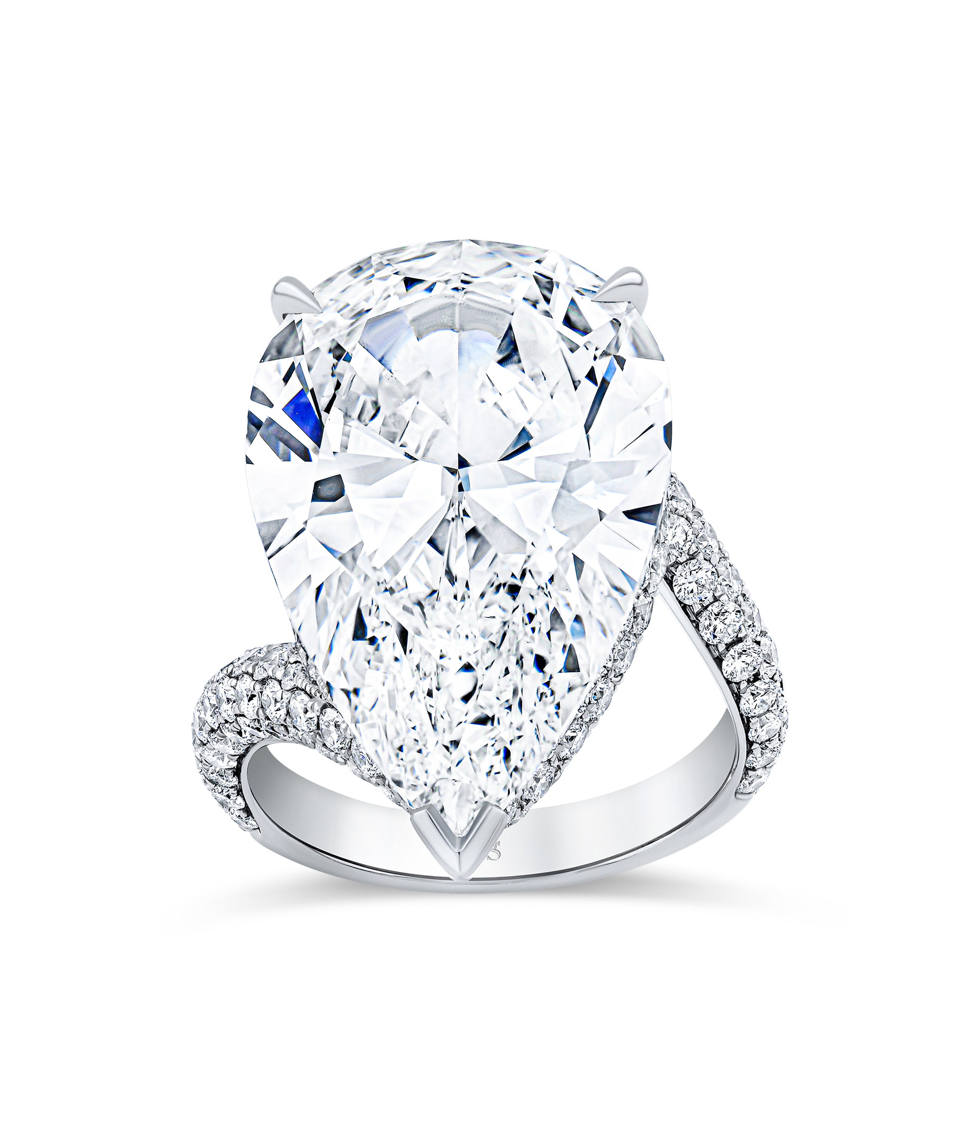 Diamond ring with a pear-shaped center stone and pave band.