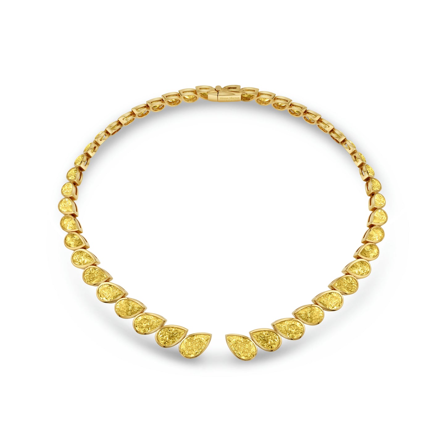 A yellow gold choker necklace with bezel set pear shape diamonds.