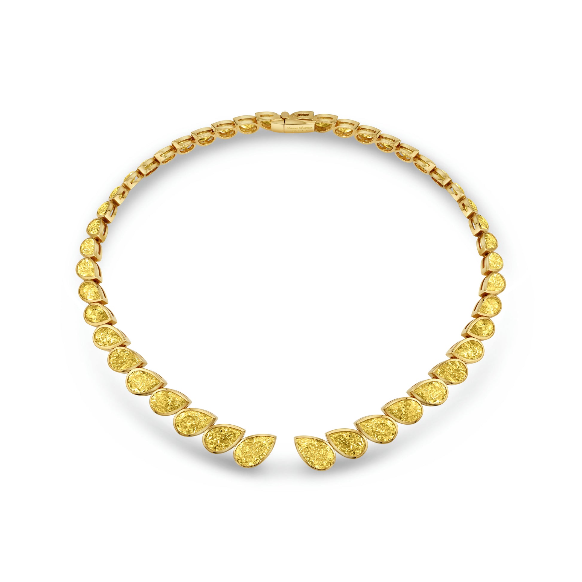 A yellow gold choker necklace with bezel set pear shape diamonds.