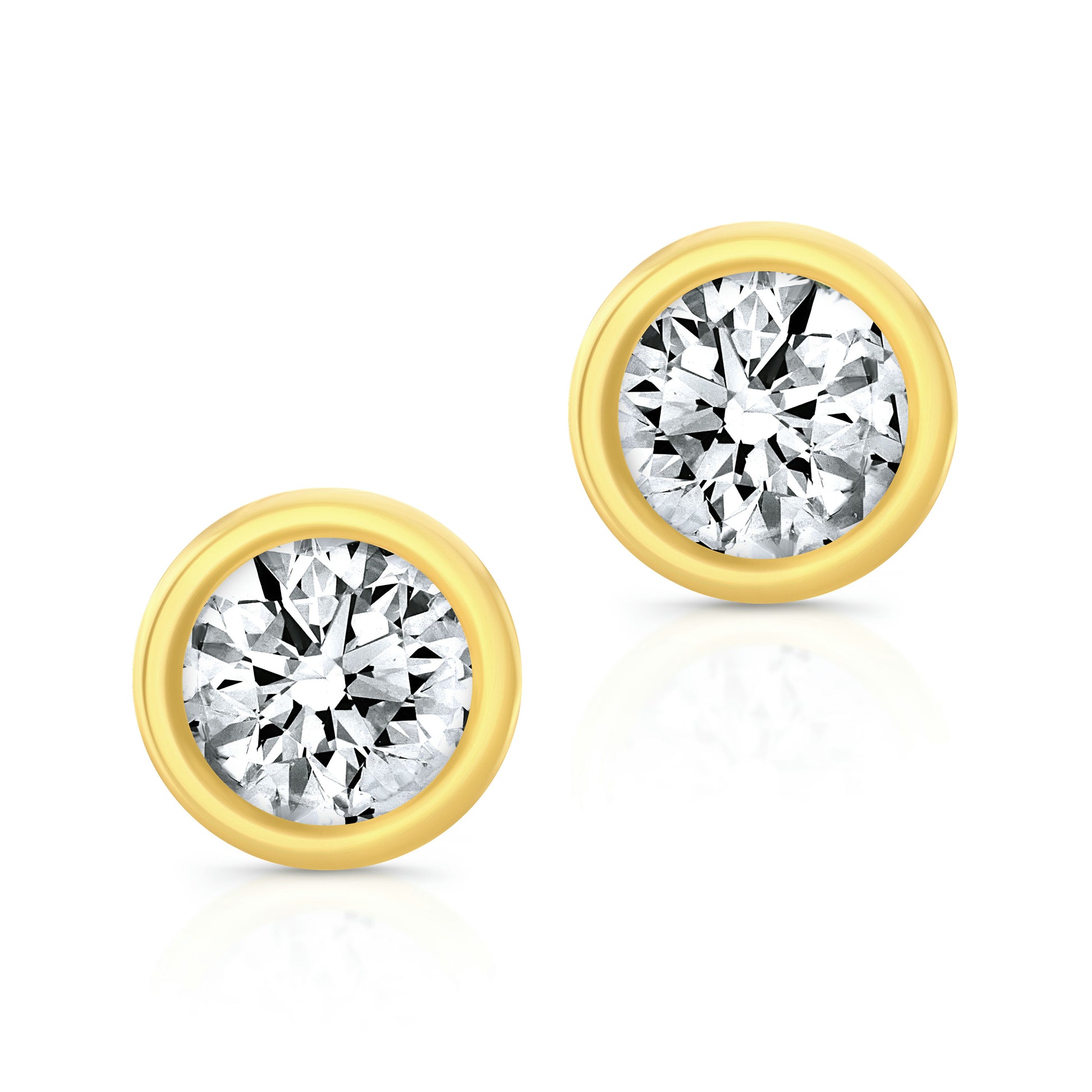 A pair of round diamond bezel set studs in 18k yellow gold.