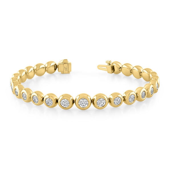 A bezel set round diamond bracelet in 18k yellow gold by Norman Silverman