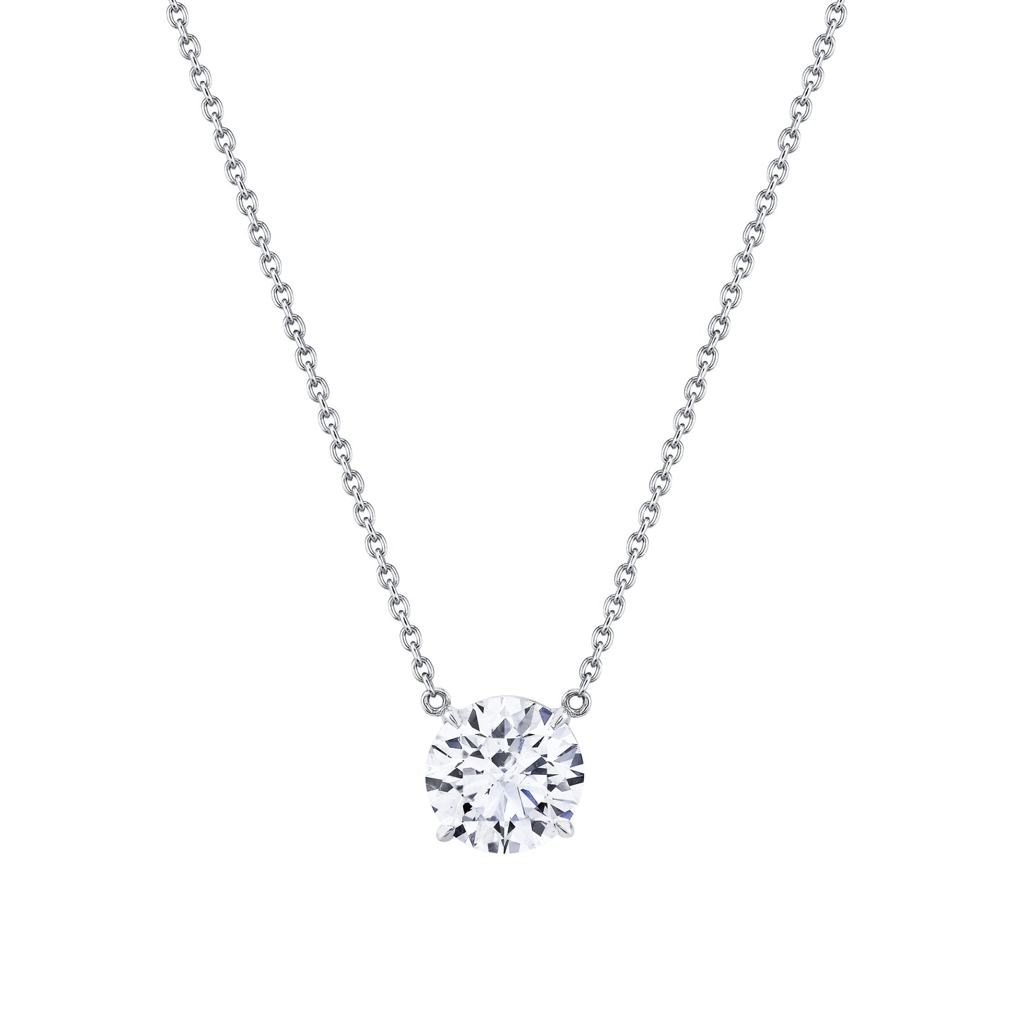 Close-up of round-cut diamond set in 18k white gold pendant by Norman Silverman Los Angeles