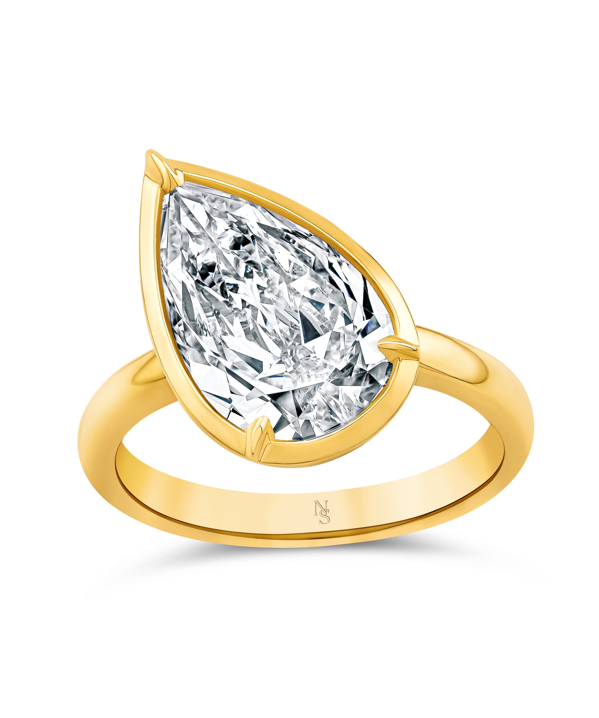 18k gold ring with a tilted pear-shaped diamond.
