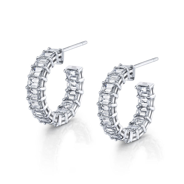 A pair of emerald cut diamond hoop earrings set in 18k gold.
