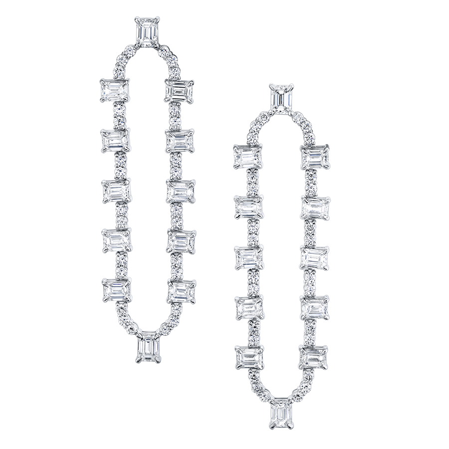 A pair of emerald-cut diamond drop earrings set in 18K white gold.