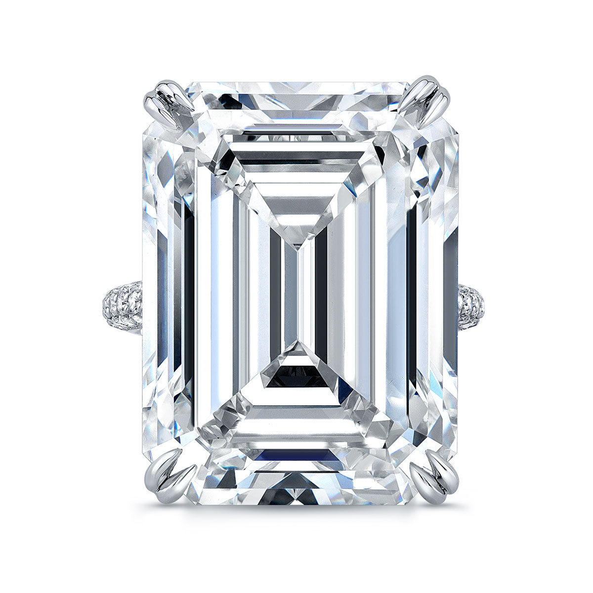 An emerald cut diamond ring with a pave band, predominantly featuring a large clear diamond in a four-prong setting, flanked by smaller diamonds on the sides.