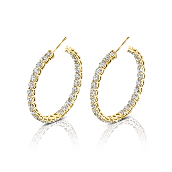 Large round diamond hoop earrings set in 18k yellow gold.