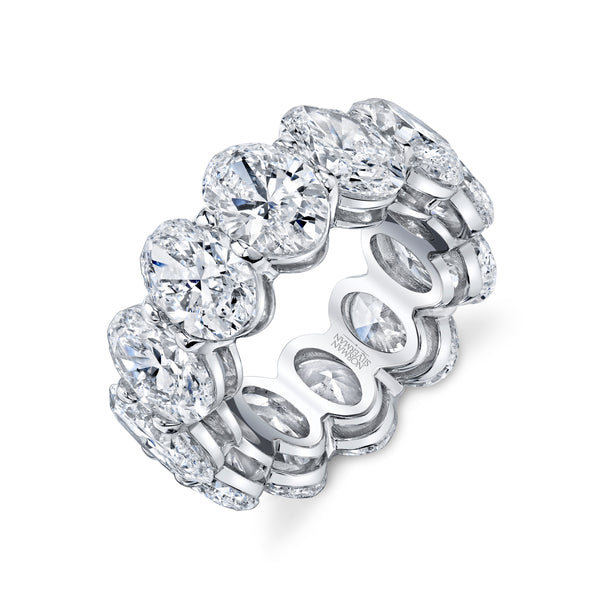 A platinum eternity band ring with oval-cut diamonds set throughout.