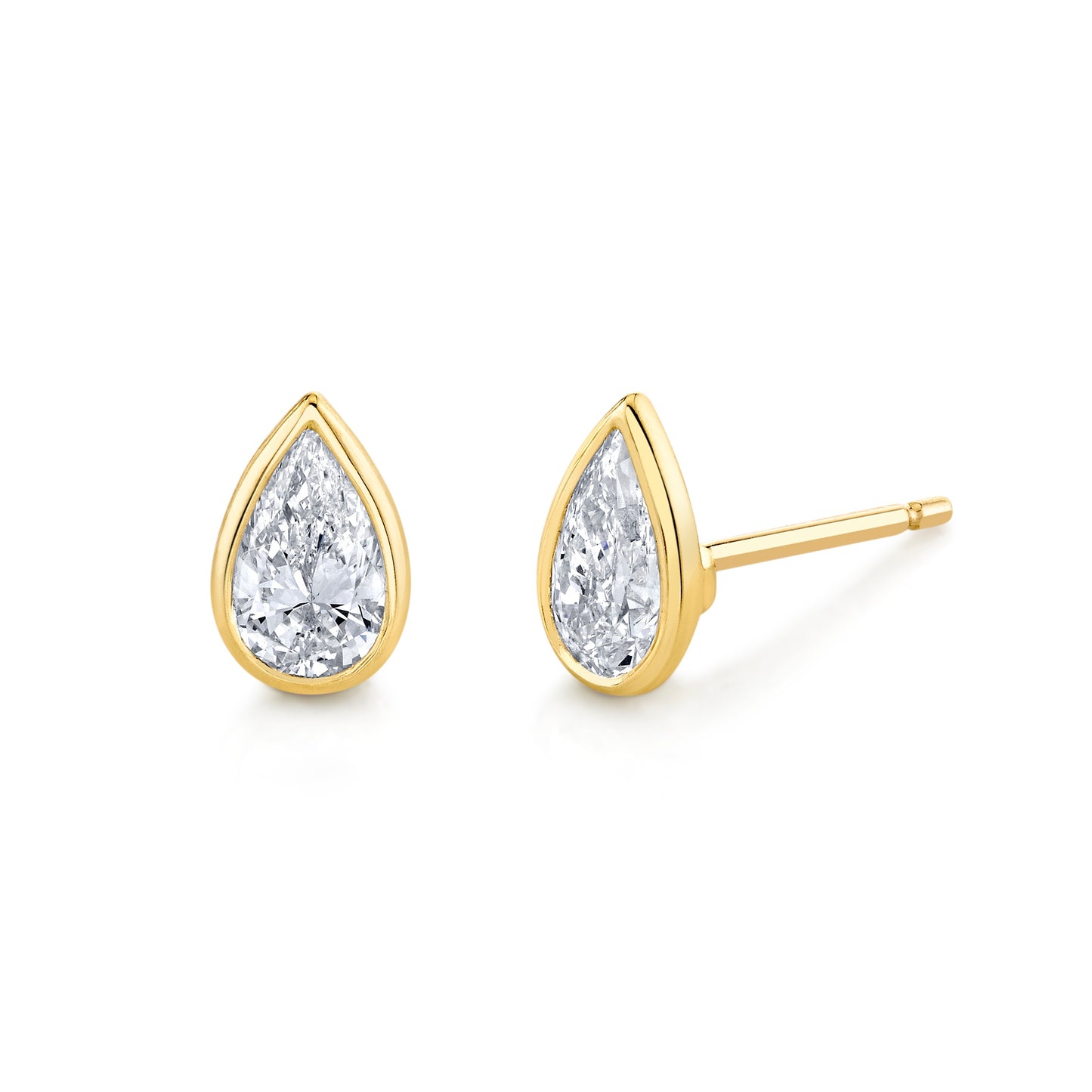 A pair of pear diamond bezel set stud earrings in 18k yellow gold.
